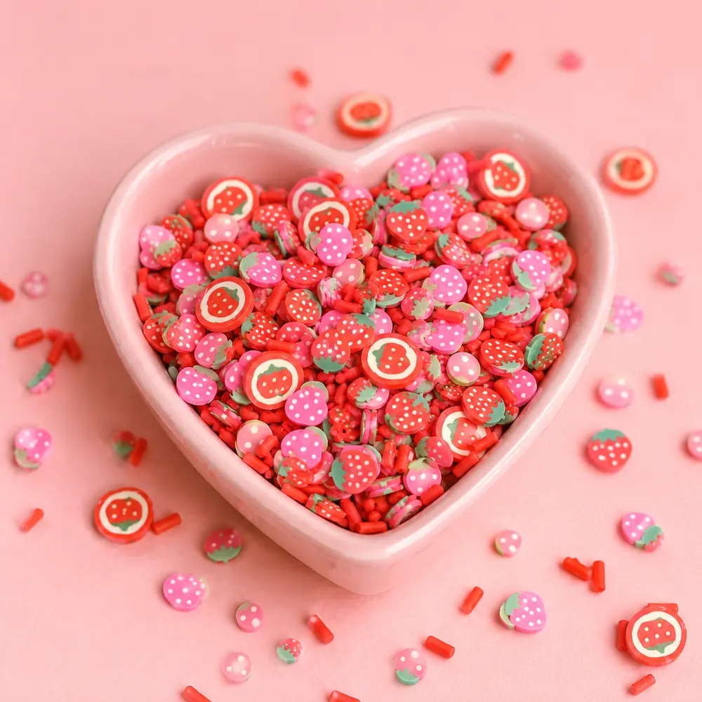 Strawberry candy polymer clay slices in heart bowl